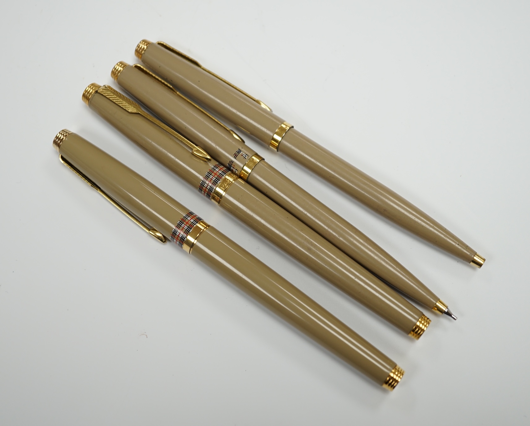 Parker for Burberry - a pair of fountain pens, a ballpoint pen and pencil in box, the vendor being an ex-Parker Pen employee